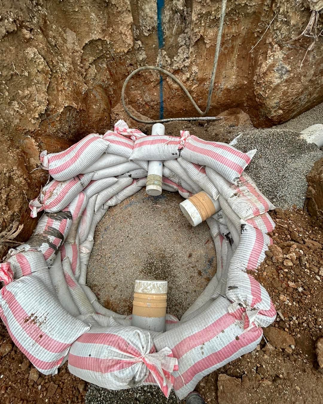 Hunter Water manhole install with sand bags for safety