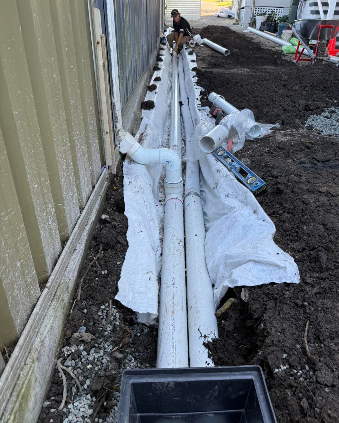 Stormwater pipe laid in trench, ready for backfill